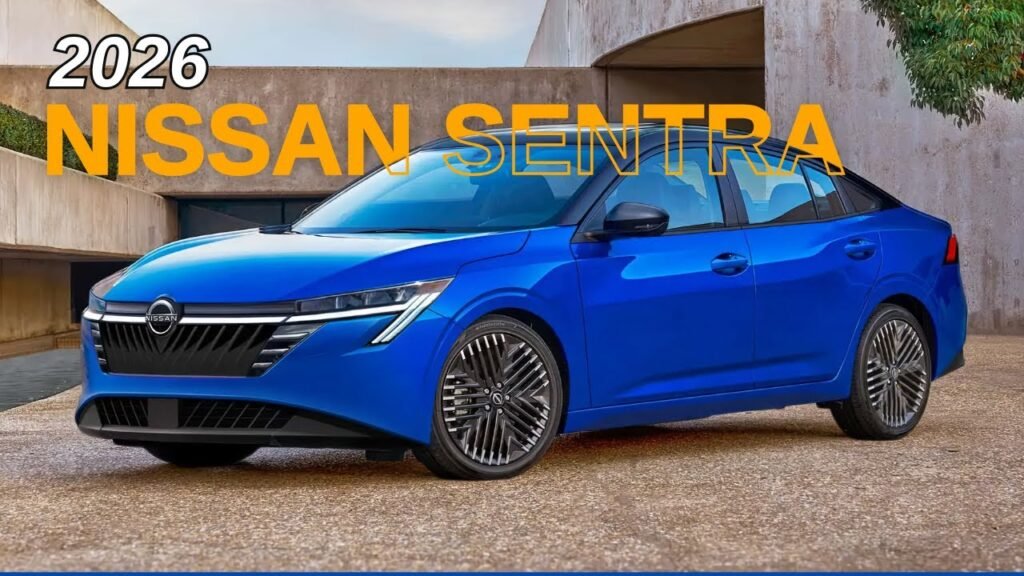 A dynamic, side-view photograph of the redesigned Nissan Sentra sedan, showcasing its sleek, fastback-like silhouette, sharp character lines, and modern V-motion grille with slim LED headlights.