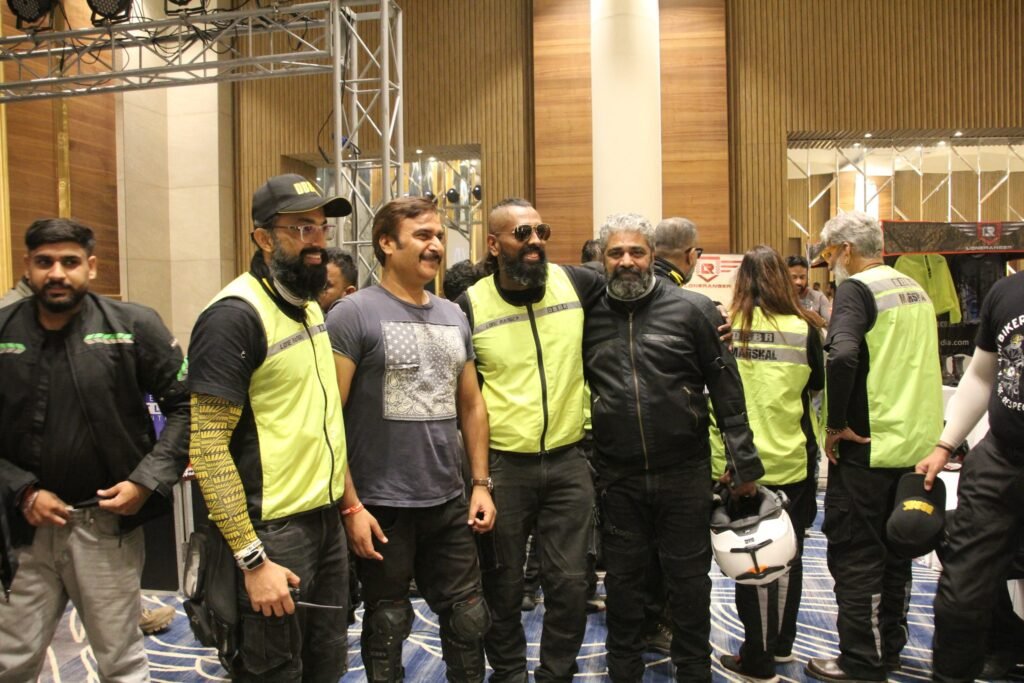 
Members of the DBBR biker group, identified by their neon safety vests, posing together after an event or ride.