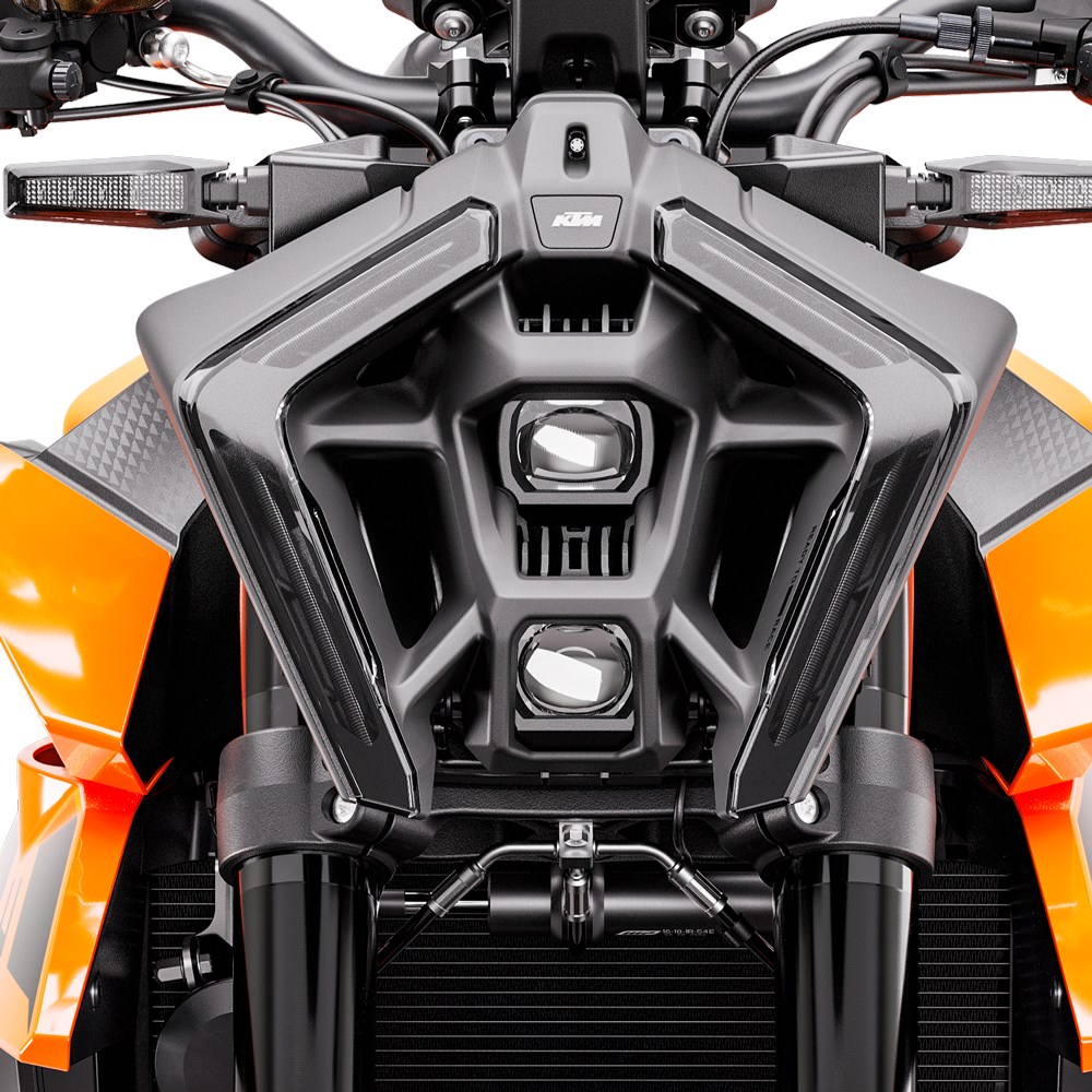 Close-up, head-on view of the distinctive black LED headlight and front mask of the KTM Duke 990.