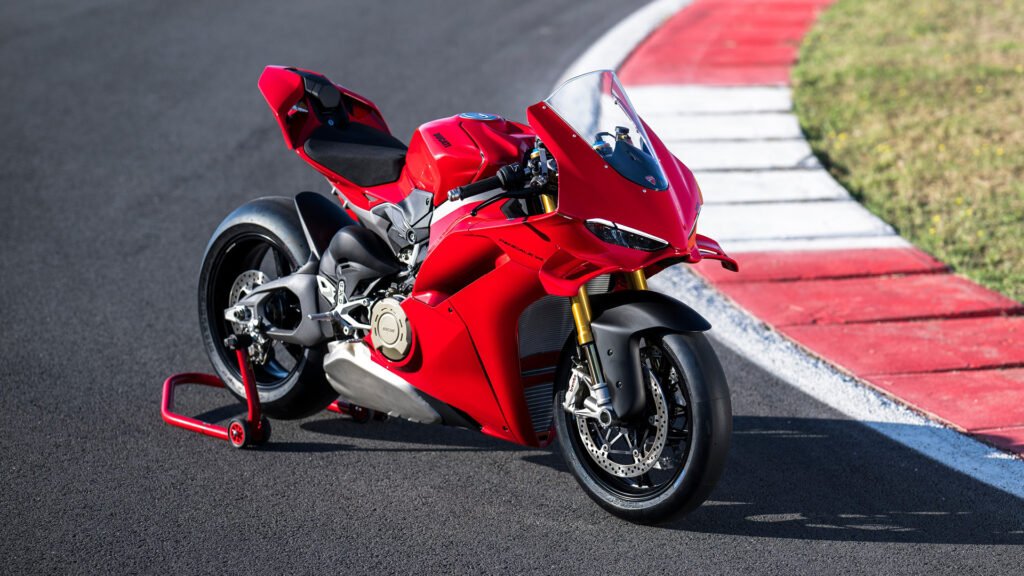 Ducati Panigale V4 2025 superbike parked on a racetrack, showcasing aggressive design, aerodynamic bodywork, and premium performance styling