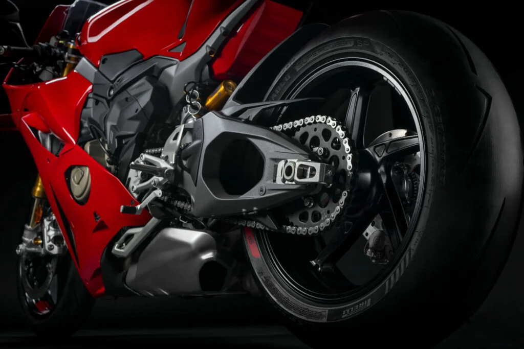 Ducati Panigale V4 2025 rear wheel and swingarm close-up showing chain drive, performance tire, and premium engineering details