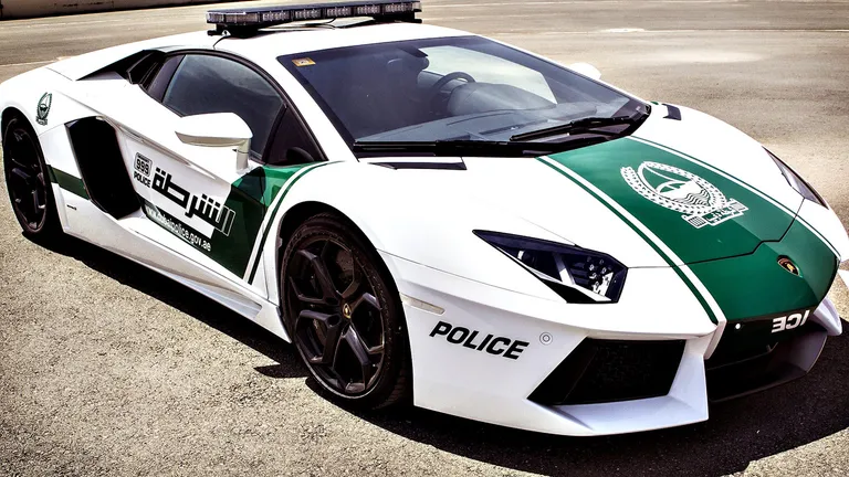 Dubai Police cars featuring a Lamborghini Aventador police supercar, showcasing luxury patrol design, high performance, and iconic Dubai Police livery